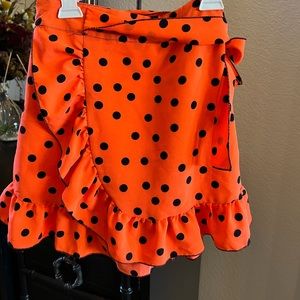 Orange and black polka dot mini skirt with ruffle accent new no tag Size 0
